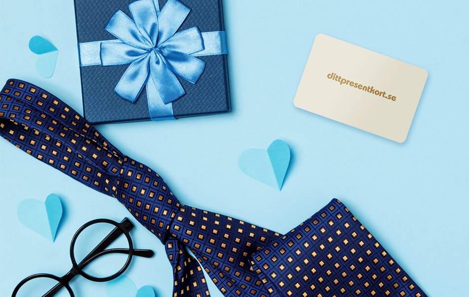 Bild av dittpresentkort på blåbakgrund med slips och glasögon