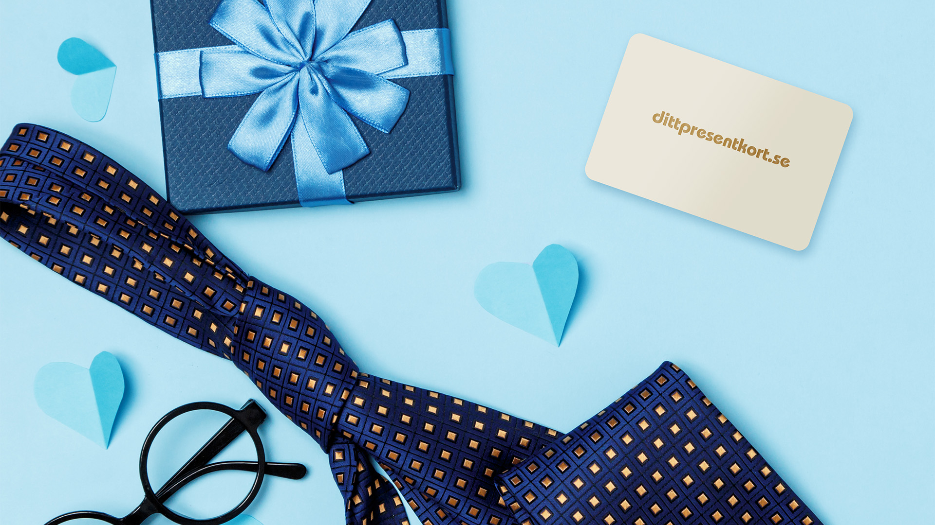 Bild av dittpresentkort på blåbakgrund med slips och glasögon